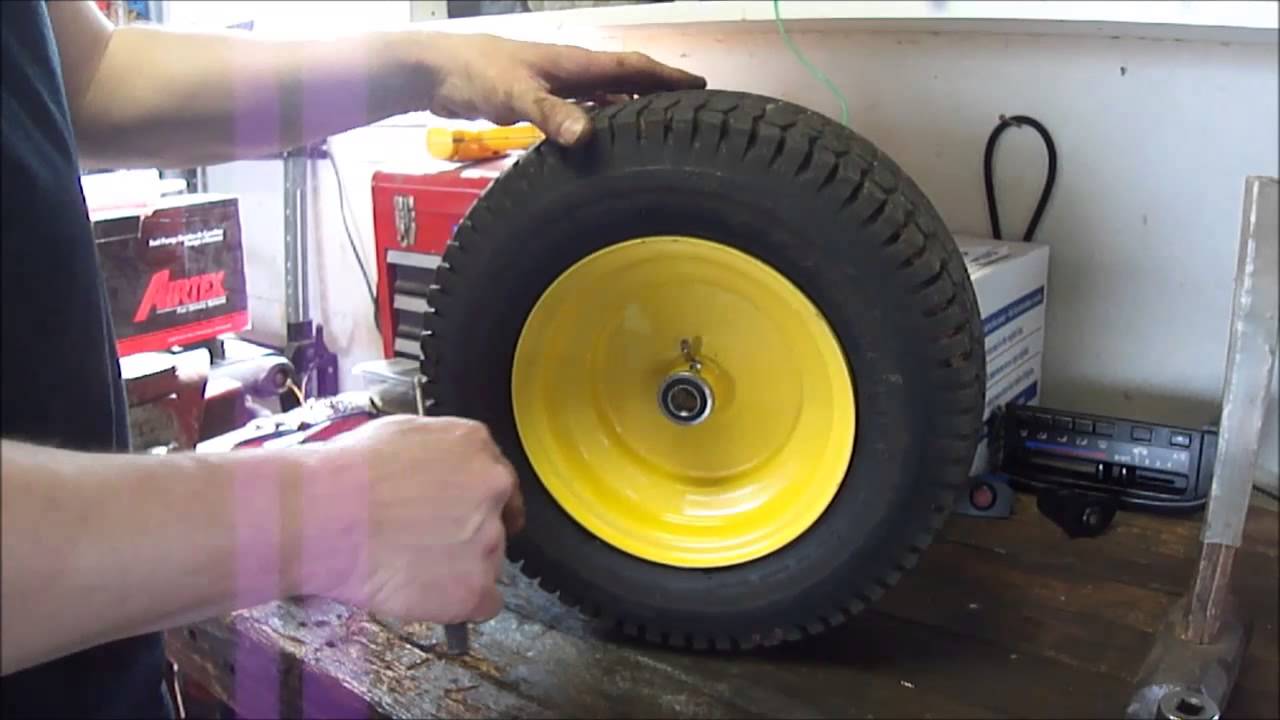 John Deere L130 front wheel bearing upgrade - YouTube