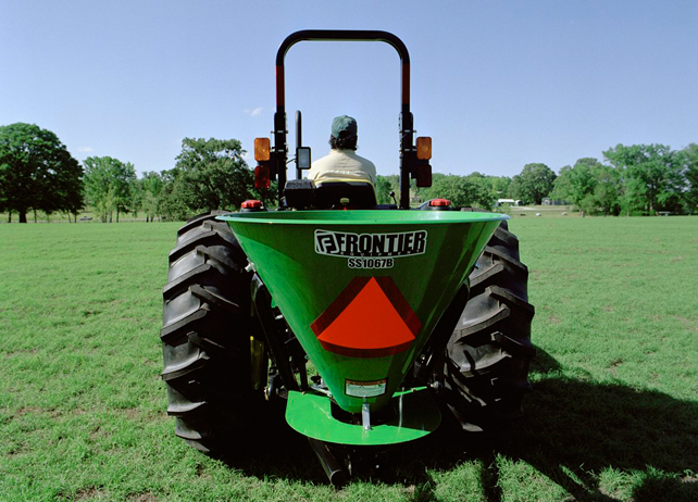 Rear view of a John Deere tractor with SS10B Series Broadcast Spreader ...