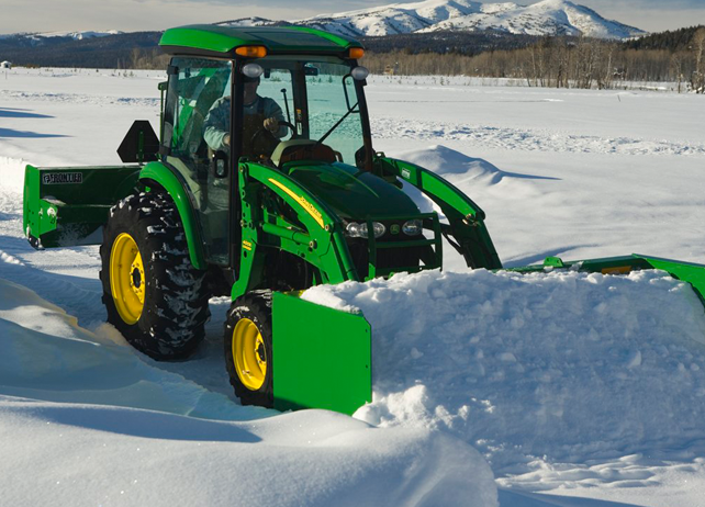 John Deere tractor using a AS11E Snow Push to clear snow
