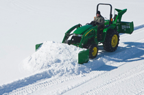 ... of a John Deere tractor using a AS10H Series Snow Push to clear snow