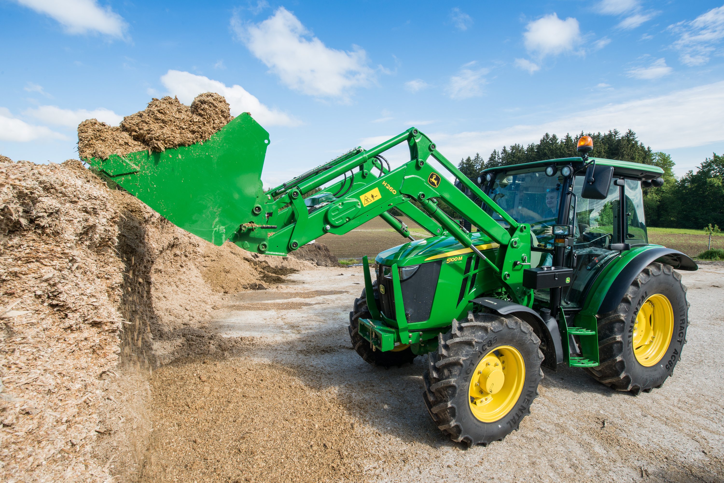 John Deere 5100M tractor with H260 front loader