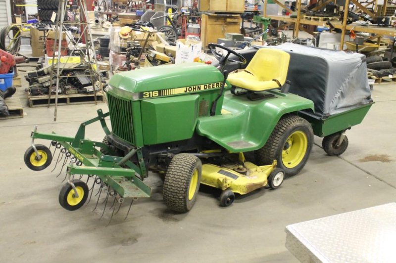 LOT #1030 - JOHN DEERE 316 LAWN TRACTOR W/BAGGER AND THATCHER
