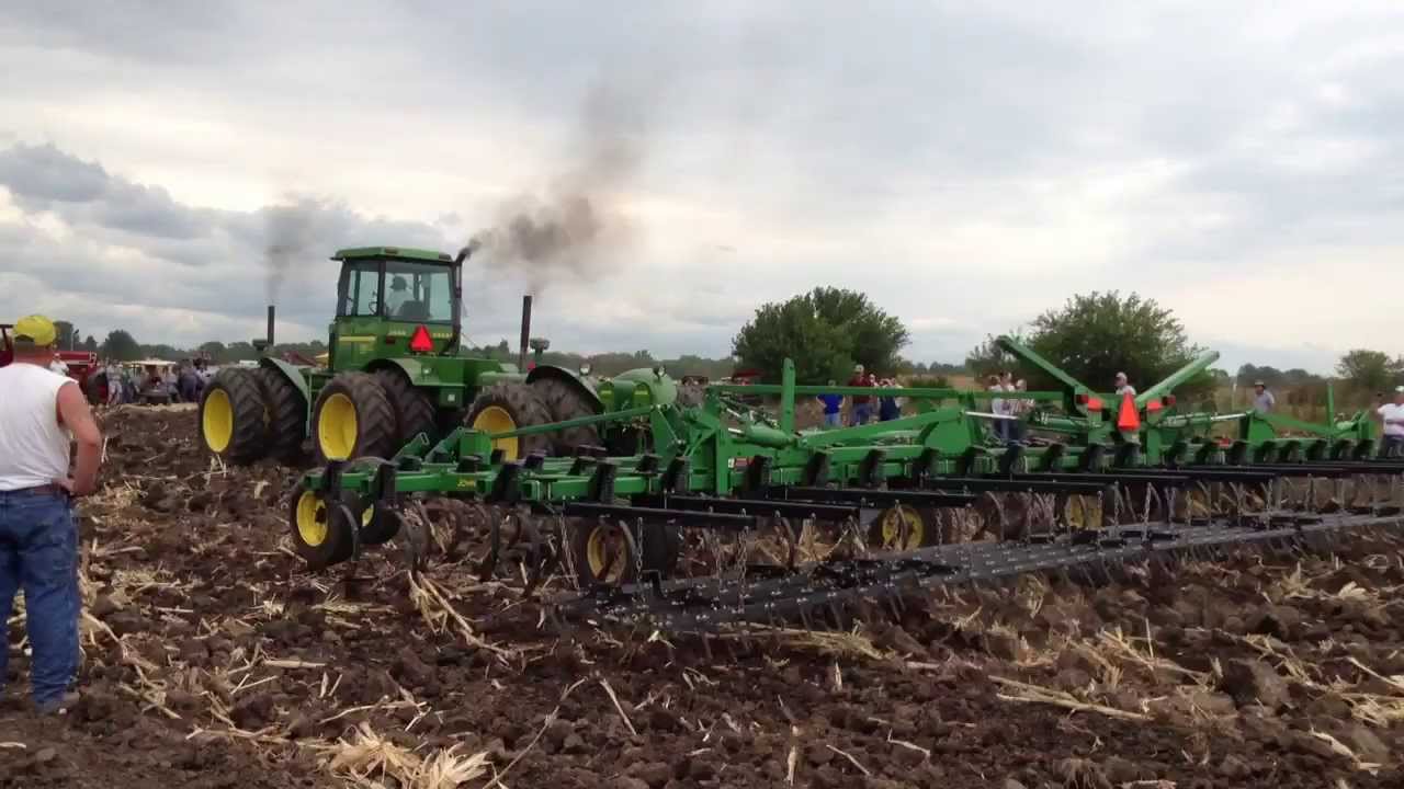 Three John Deere 830s pulling a 45 foot field cultivator ...