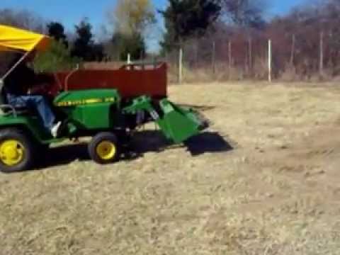 John Deere 318 with Buford Bucket.wmv - YouTube