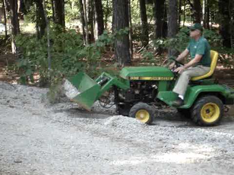 John Deere 332 with Buford Bucket Moving Gravel - YouTube