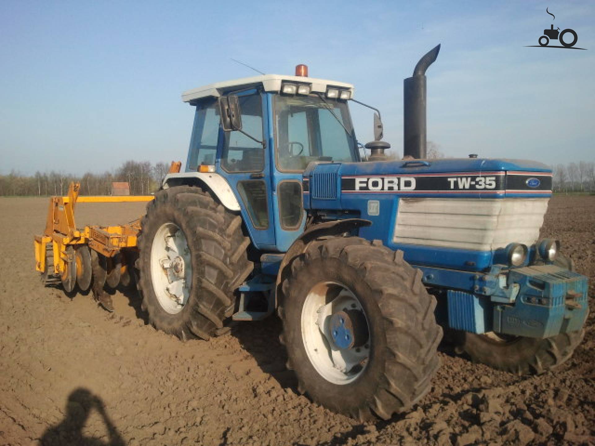 Pin Ford Tw 35 Two Ploughs With Front Mounted 3 Furrow And 6 on ...