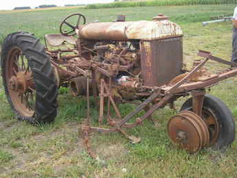 This is a 1938 Fordson Model N All Around with corn cultivator
