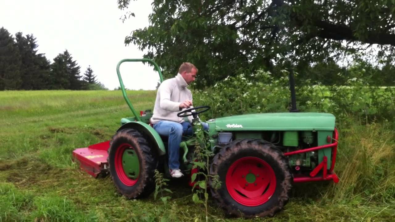 Holder AG35 mit Mulcher Knicklenker Traktor mulcht Hochgras ...