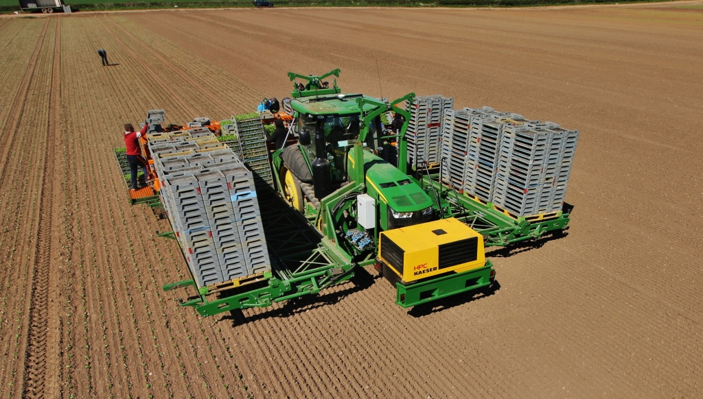 John deere 8370RT on rowtracs with an 8 meter wide lettuce planting ...