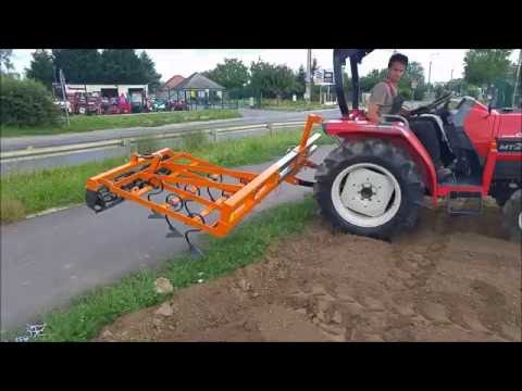 Kubota KL550 ploughing a rice field in Japan. Japán traktor váltva ...