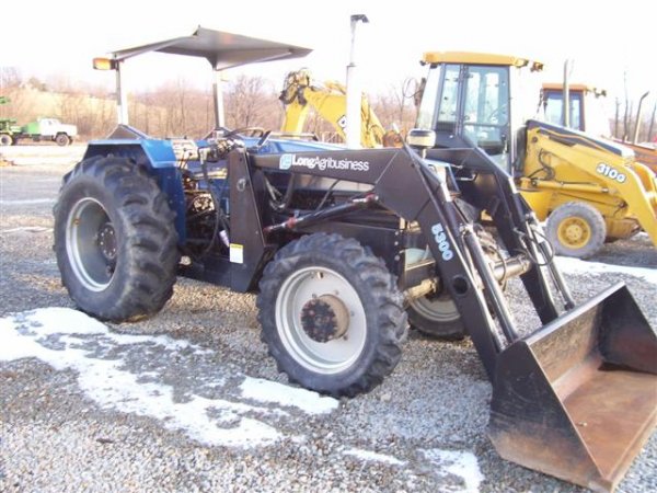 21: LONG AGRIBUSINESS 680 DTC 4WD TRACTOR W/LOADER 