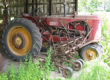 Massey Harris row-crop 44 and cultivator with wheel weights. This was ...