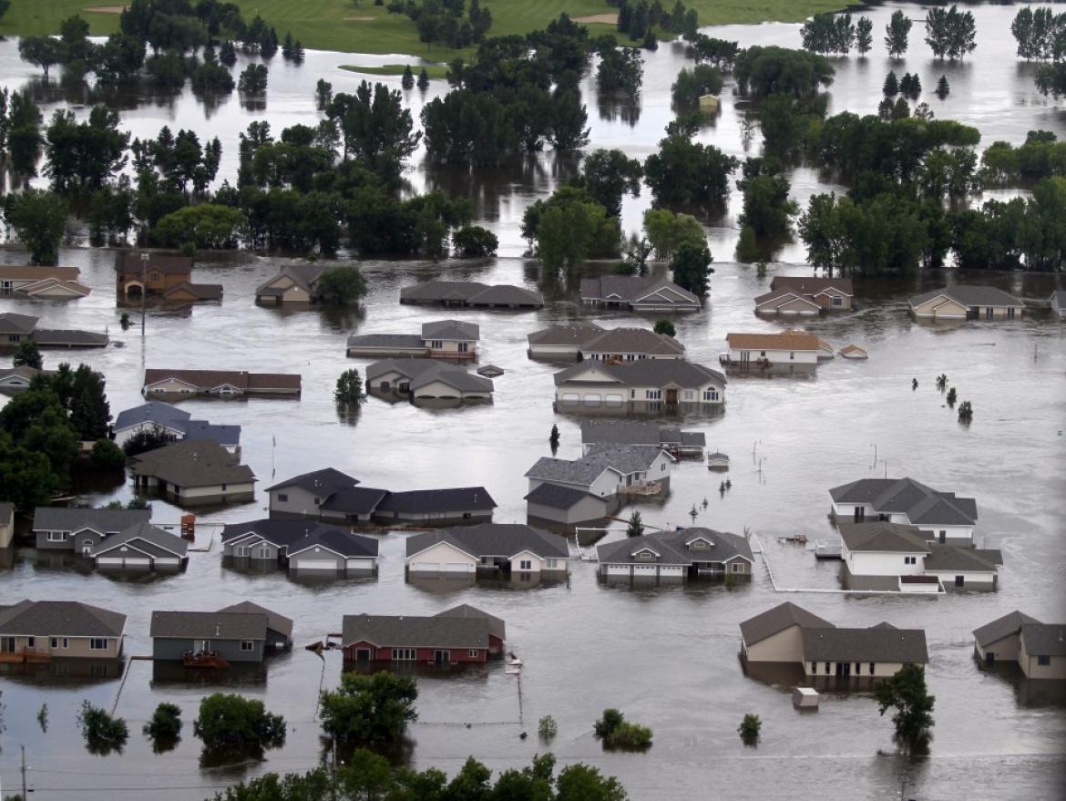 Newer housing are flooded on the southwest side of Minot, North Dakota ...