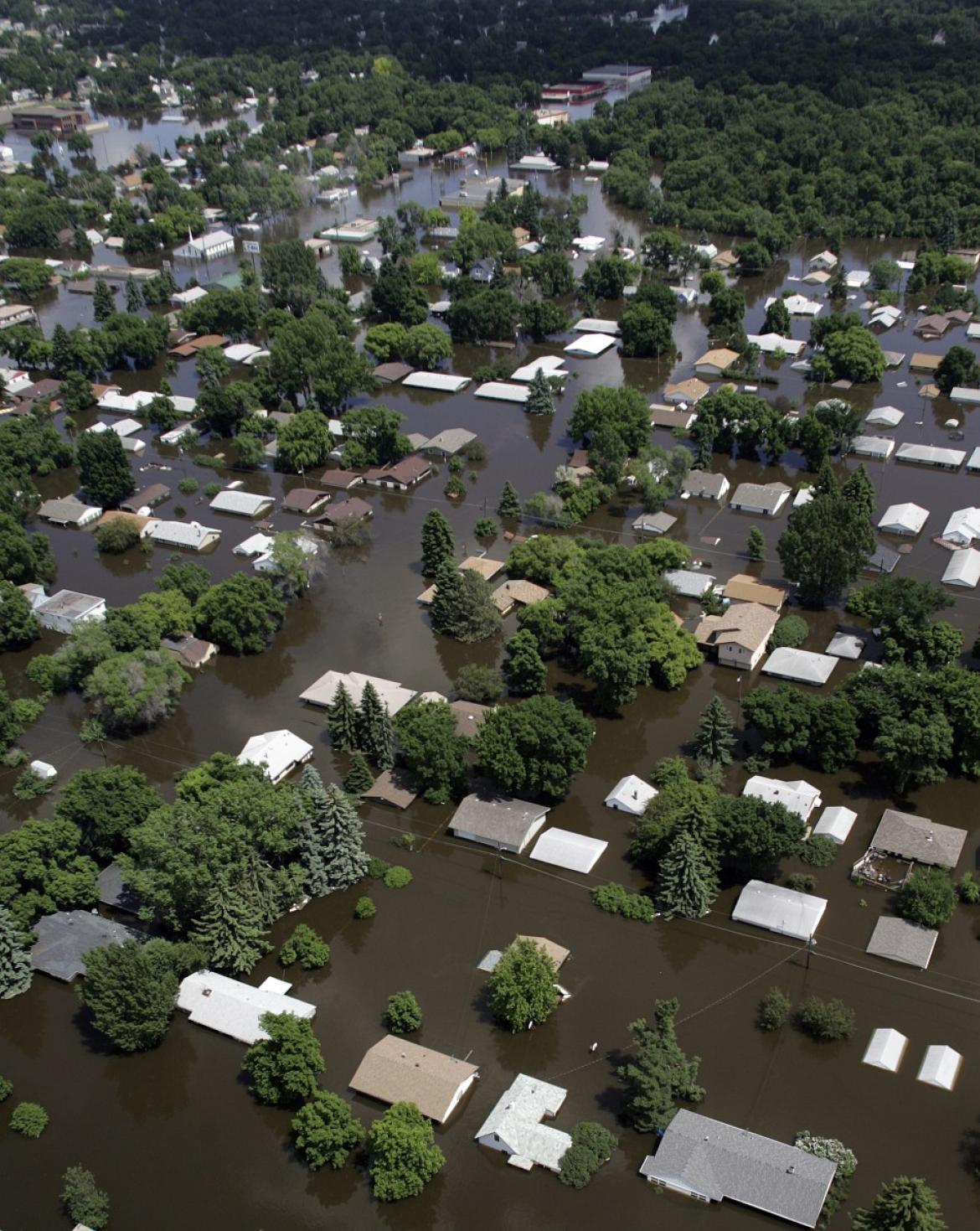 Houses are submerged in flood waters in Minot, North Dakota, as the ...