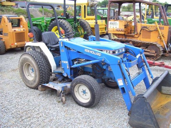 222: FORD NEW HOLLAND 1620 4WD TRACTOR W/LOADER/MOWER : Lot 222