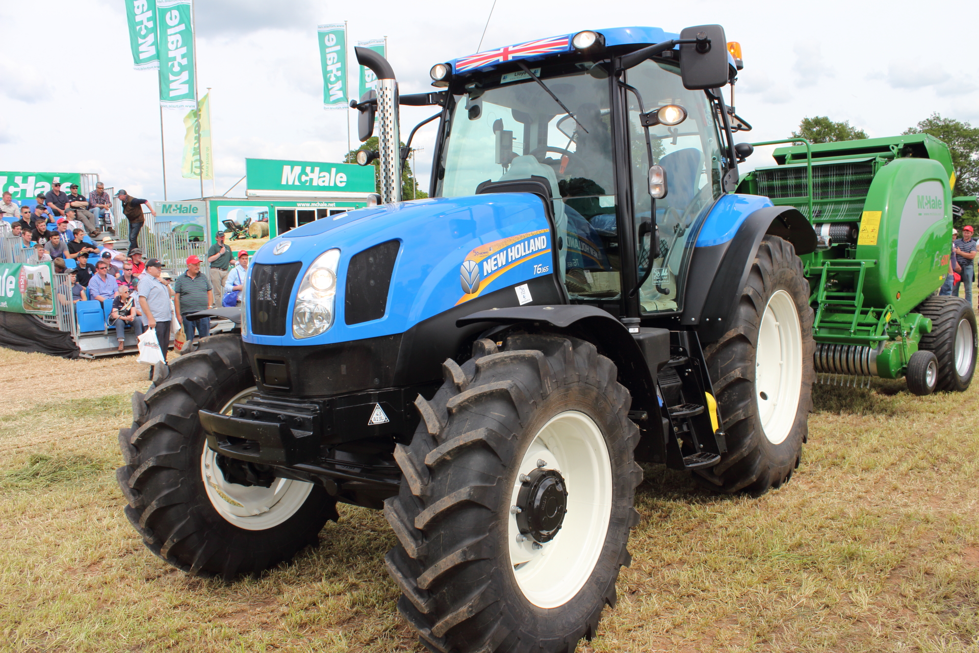 New Holland T6.165 driving McHale Baler at Grassland And Muck 2014