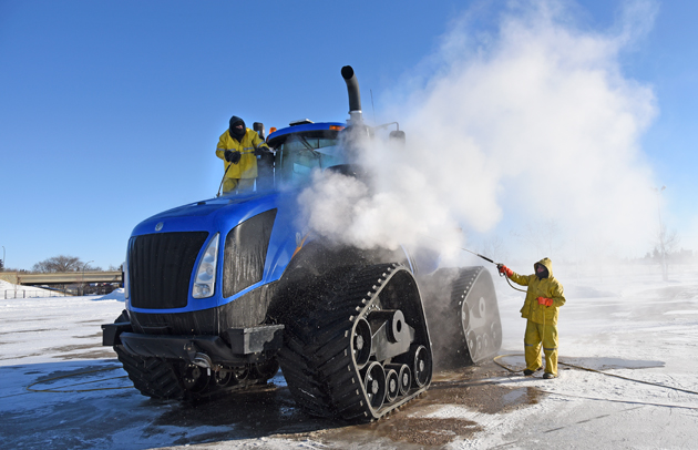 and Lee Bendig of Williams Mobile Power Wash rinse a New Holland T9600 ...