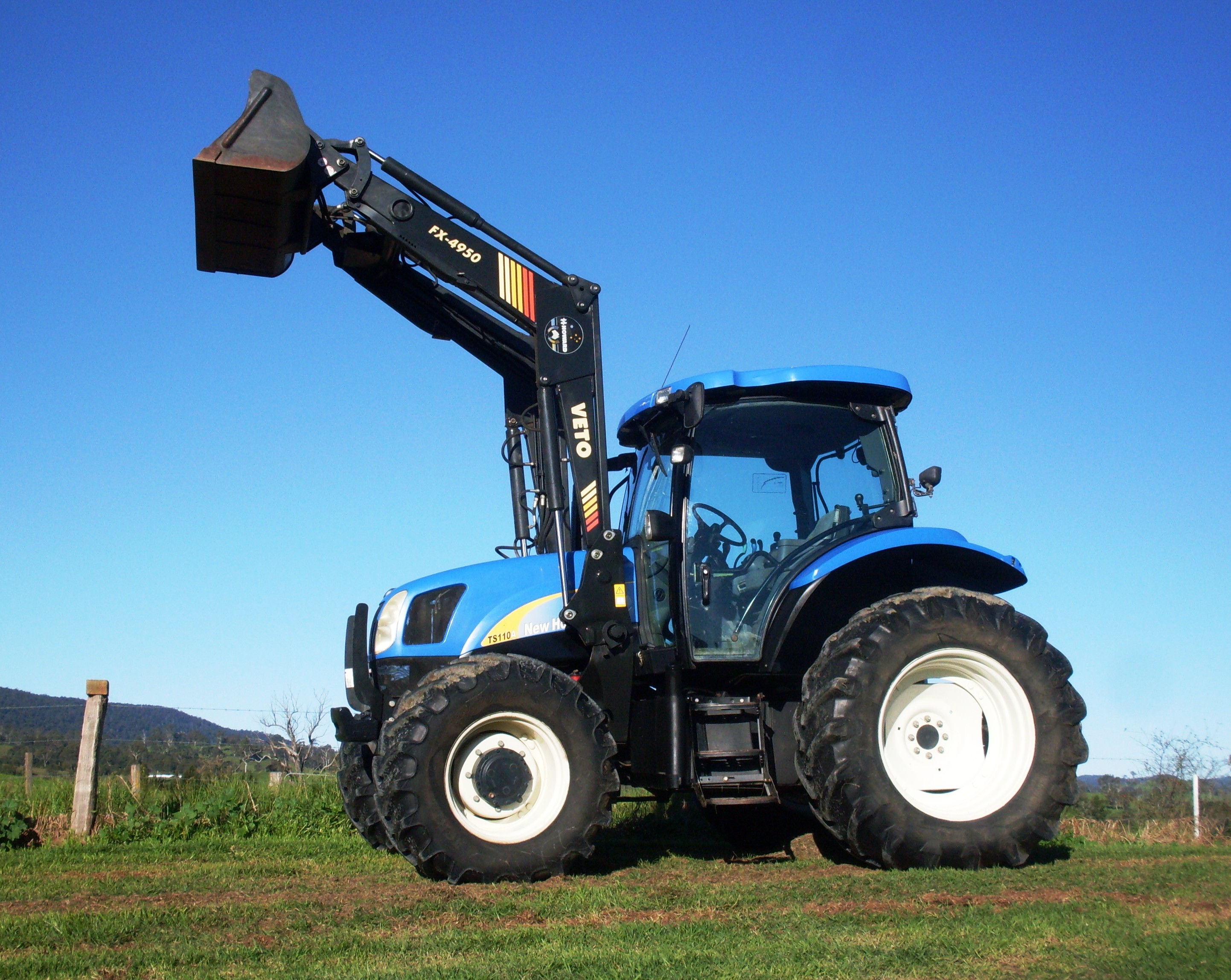 USED NEW HOLLAND TS110A TRACTOR & LOADER for sale.
