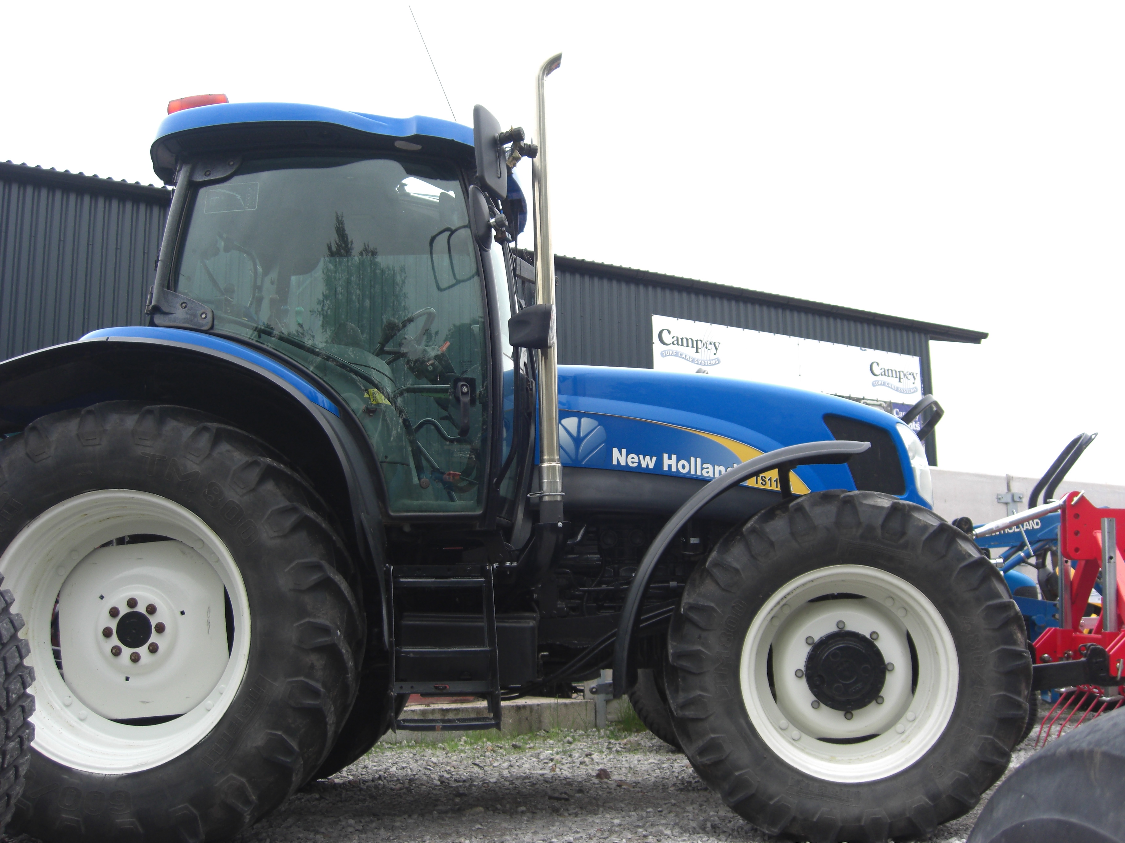 New Holland TS115a – Campey Turf Care Systems