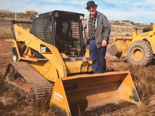 Sheldon Johnson works with heavy equipment at his farm along Riverside ...