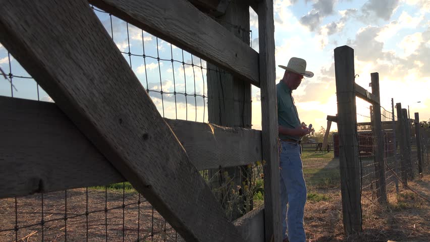 Cowboy Ranch Hand Working On The Fences Sunrise To Sunset. Man Using ...