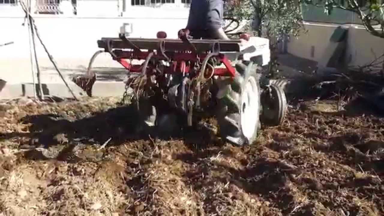 small satoh tractor plowing in portugal - YouTube