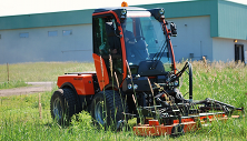 Cushman Motor Company – Holder C270 tractor with rotary mower