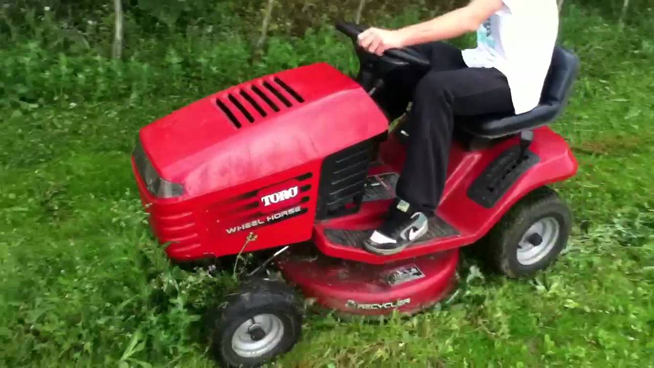 toro wheel horse 12-32 xl moving high weeds - YouTube