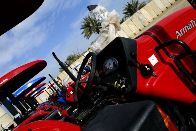 BAGHDAD- A line of ArmaTrac 602 tractors presented to local Sheiks in ...