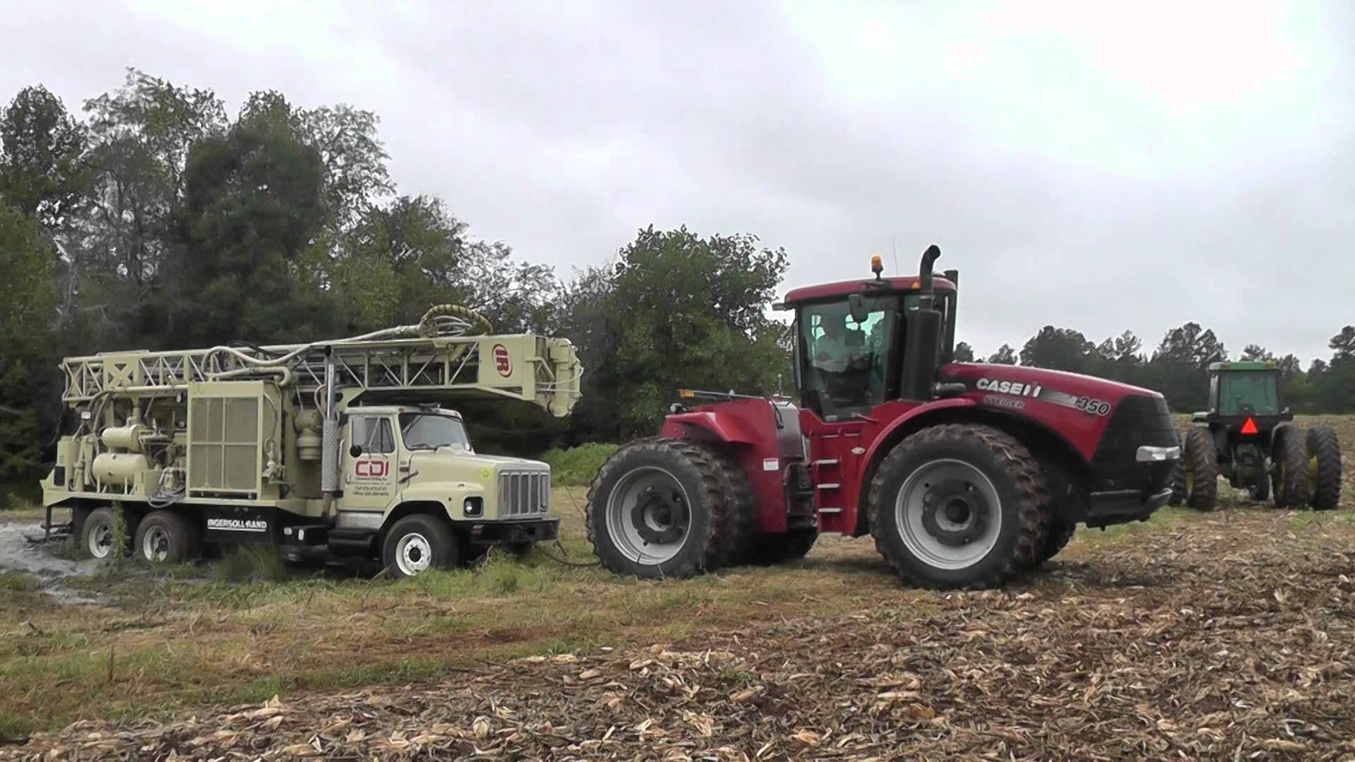 Case IH Steiger 350 Pulls out stuck well drilling rig - YouTube