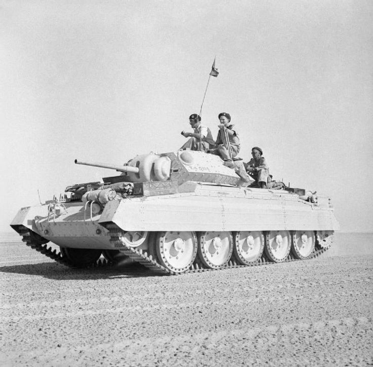 Crusader mk3 (?) in desert with crew out, most likely staged camera ...
