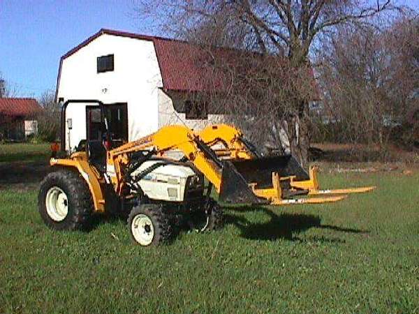 ... Cub Cadet 7275. Description: My Cub in front of barn with fork lifts