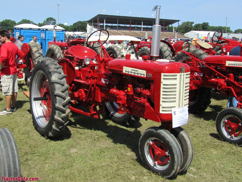 Farmall 230 with tricycle front end. (2 images)
