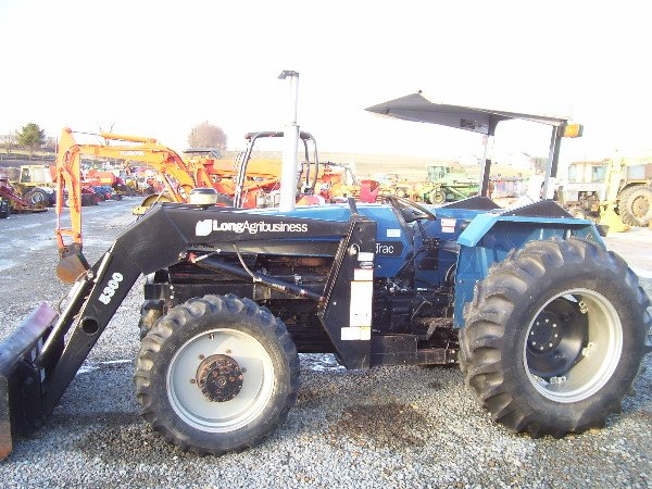 21: LONG AGRIBUSINESS 680 DTC 4WD TRACTOR W/LOADER 